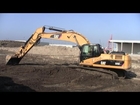 Cat 325D Grading On A Summer Day