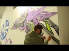 Aerosol Artist 'Astek' spray painting the walls of the Underdog Gallery